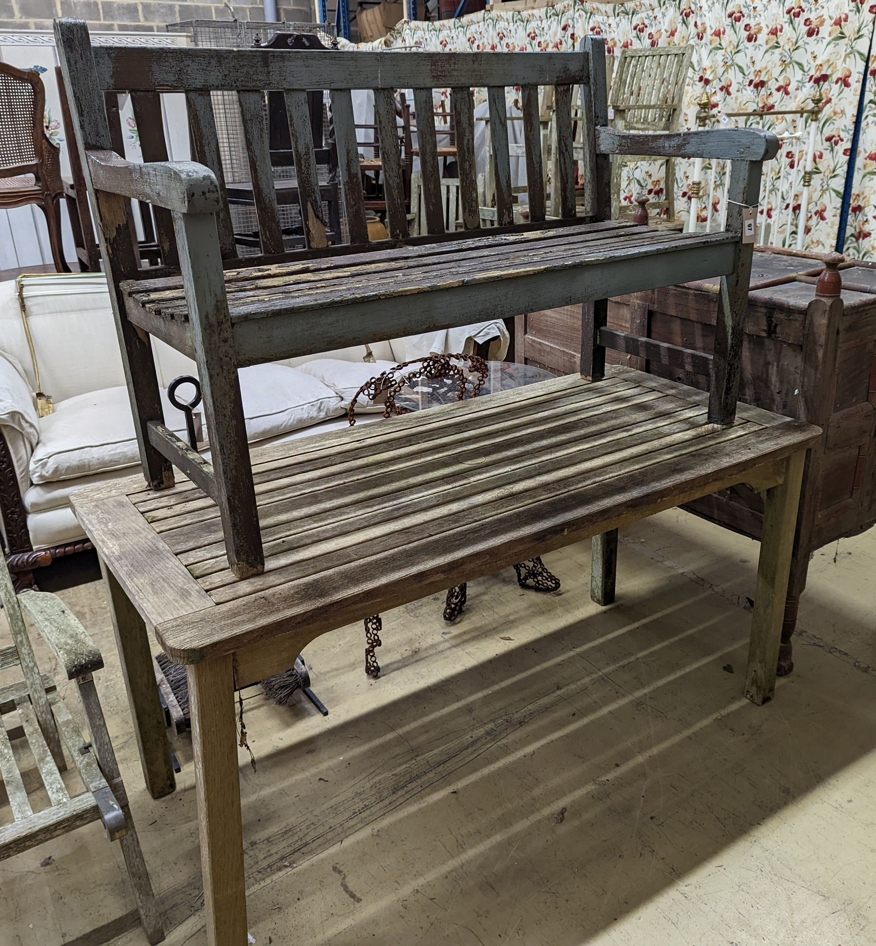 A weathered teak garden bench and rectangular table. Bench - W-122cm, D-54cm, H-83cm. Table - W-149cm, D-70cm, H-74cm.